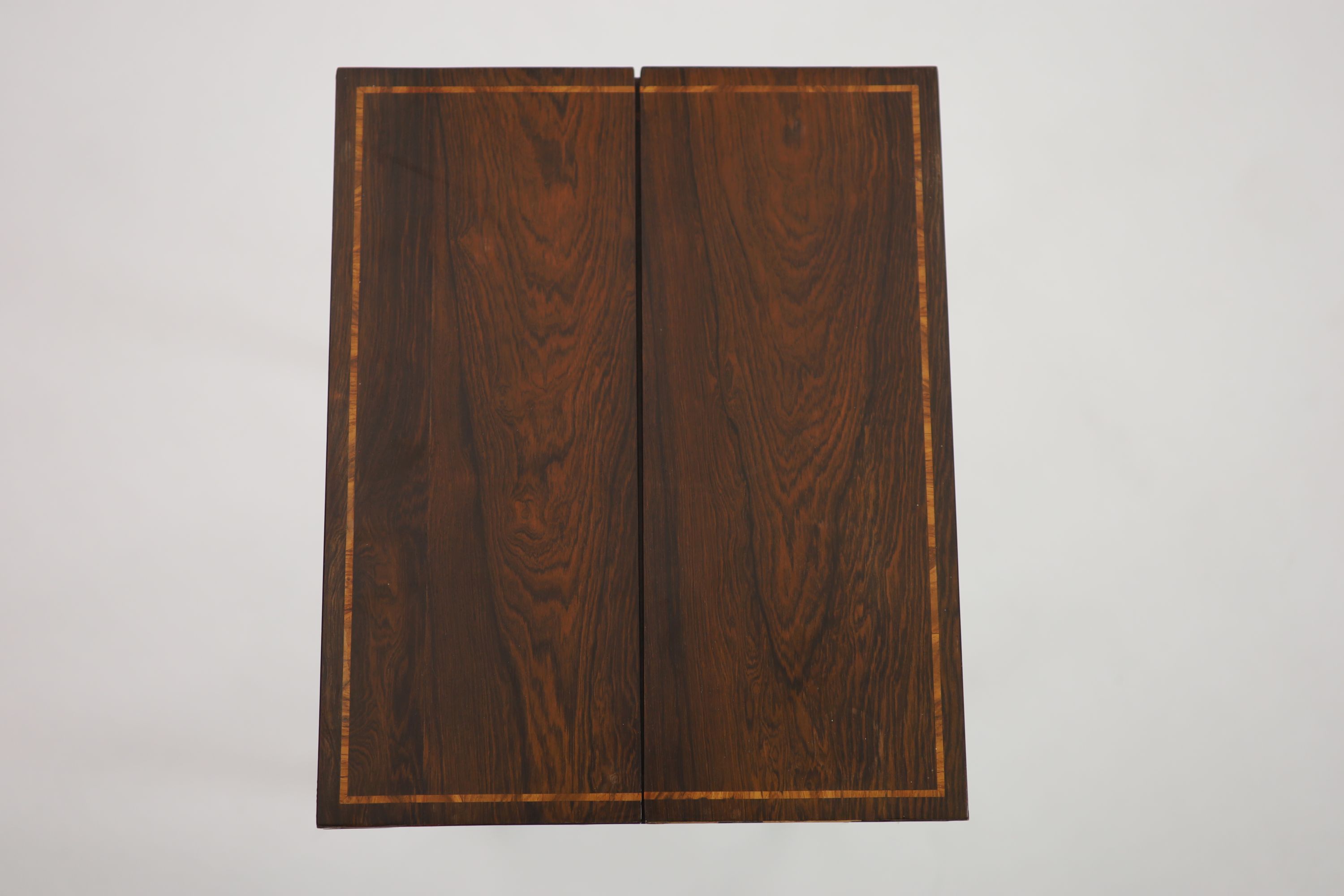 A Regency inlaid rosewood and ebony writing table, W.46cm D.37cm H.78cm